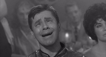 Movie still from “Visit to a Small Planet” (1960), directed by Norman Taurog – A young man with his mouth wide open and his eyes wide open; Close Up shot, Over the shoulder angle