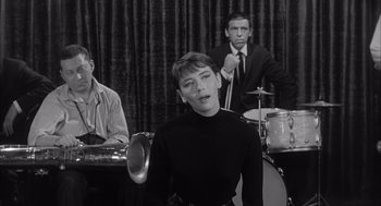 Movie still from “Visit to a Small Planet” (1960), directed by Norman Taurog – A black and white photo of a woman and two other men; Medium shot, High angle