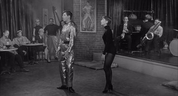 Movie still from “Visit to a Small Planet” (1960), directed by Norman Taurog – A man and a woman are standing in front of a group of people; Wide shot, Low angle