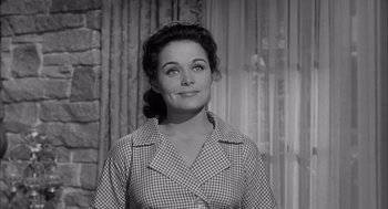 Movie still from “Visit to a Small Planet” (1960), directed by Norman Taurog – A black - and - white photo of a woman in a checkered shirt; Close Up shot, Low angle