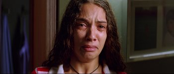 Movie still from “Volver” (2006), directed by Pedro Almodóvar – A person with a crying face; Close Up shot, Overhead angle