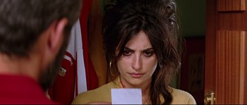Movie still from “Volver” (2006), directed by Pedro Almodóvar – A woman holding a piece of paper in her hand; Close Up shot, Over the shoulder angle