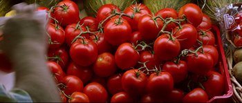 Movie still from “Volver” (2006), directed by Pedro Almodóvar – A bunch of tomatoes that are sitting in a pile; Extreme Close Up shot, Overhead angle