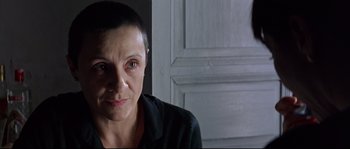 Movie still from “Volver” (2006), directed by Pedro Almodóvar – A person with short hair; Close Up shot, Over the shoulder angle