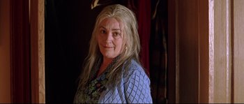 Movie still from “Volver” (2006), directed by Pedro Almodóvar – A person with long white hair; Close Up shot, Low angle