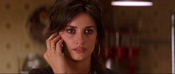 Movie still from “Volver” (2006), directed by Pedro Almodóvar – A person talking on a cell phone; Close Up shot, High angle
