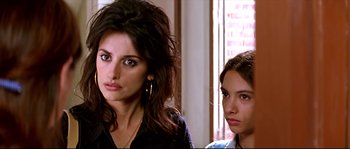 Movie still from “Volver” (2006), directed by Pedro Almodóvar – A woman and a young girl standing next to each other; Close Up shot, Over the shoulder angle