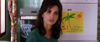 Movie still from “Volver” (2006), directed by Pedro Almodóvar – A person wearing a green shirt; Close Up shot, Over the shoulder angle