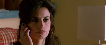 Movie still from “Volver” (2006), directed by Pedro Almodóvar – A person talking on a cell phone; Close Up shot, High angle