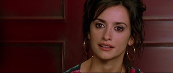 Movie still from “Volver” (2006), directed by Pedro Almodóvar – A person wearing a necklace; Close Up shot, Over the shoulder angle