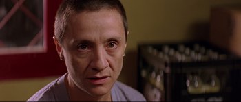 Movie still from “Volver” (2006), directed by Pedro Almodóvar – A person with a piercing on his ear; Close Up shot, Over the shoulder angle