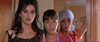 Movie still from “Volver” (2006), directed by Pedro Almodóvar – A group of women standing next to each other in a room; Close Up shot, Over the shoulder angle
