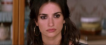 Movie still from “Volver” (2006), directed by Pedro Almodóvar – A person wearing gold jewelry; Close Up shot, Over the shoulder angle