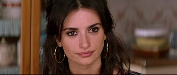 Movie still from “Volver” (2006), directed by Pedro Almodóvar – A person wearing gold jewelry; Close Up shot, Over the shoulder angle
