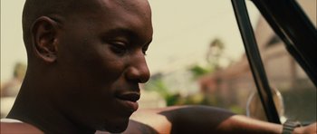 Movie still from “Waist Deep” (2006), directed by Vondie Curtis-Hall – A man's face looking to his left; Close Up shot, Over the shoulder angle