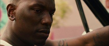 Movie still from “Waist Deep” (2006), directed by Vondie Curtis-Hall – A man's face in a car; Close Up shot, Low angle