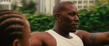Movie still from “Waist Deep” (2006), directed by Vondie Curtis-Hall – A person wearing a tank top; Close Up shot, Low angle