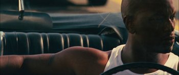 Movie still from “Waist Deep” (2006), directed by Vondie Curtis-Hall – A person sitting in a car; Close Up shot, Over the shoulder angle