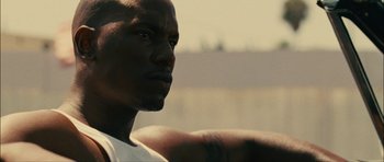 Movie still from “Waist Deep” (2006), directed by Vondie Curtis-Hall – A man's face and shoulders; Close Up shot, Low angle