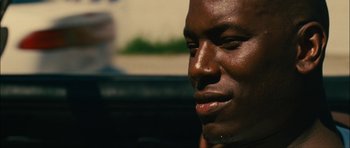 Movie still from “Waist Deep” (2006), directed by Vondie Curtis-Hall – A man's face with water droplets on his face; Close Up shot, Low angle