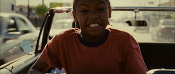 Movie still from “Waist Deep” (2006), directed by Vondie Curtis-Hall – A person with a red shirt; Close Up shot, Low angle