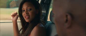Movie still from “Waist Deep” (2006), directed by Vondie Curtis-Hall – A woman sitting in the back seat of a car; Close Up shot, Over the shoulder angle