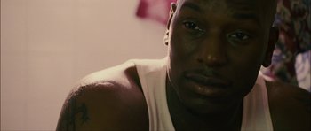 Movie still from “Waist Deep” (2006), directed by Vondie Curtis-Hall – A man's face in a white shirt; Close Up shot, High angle