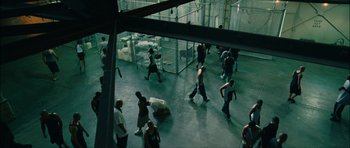 Movie still from “Waist Deep” (2006), directed by Vondie Curtis-Hall – A group of people walking around a building; Extreme Wide shot, High angle