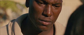 Movie still from “Waist Deep” (2006), directed by Vondie Curtis-Hall – A man's face in the sunlight; Close Up shot, High angle
