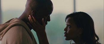 Movie still from “Waist Deep” (2006), directed by Vondie Curtis-Hall – A man and a woman looking at one another; Close Up shot, Low angle