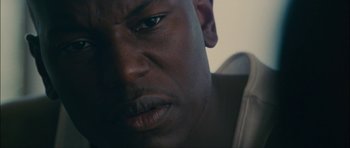 Movie still from “Waist Deep” (2006), directed by Vondie Curtis-Hall – A person's face in a room; Extreme Close Up shot, High angle