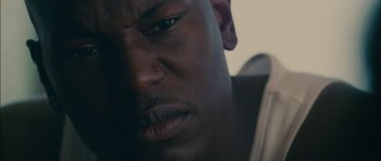 Movie still from “Waist Deep” (2006), directed by Vondie Curtis-Hall – A man's face with his eyes wide open; Extreme Close Up shot, High angle