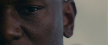 Movie still from “Waist Deep” (2006), directed by Vondie Curtis-Hall – View of a person's face and ear; Extreme Close Up shot, Low angle