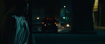 Movie still from “Waist Deep” (2006), directed by Vondie Curtis-Hall – A blurry picture of a truck in the dark at night; Close Up shot, Over the shoulder angle