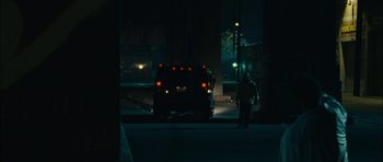 Movie still from “Waist Deep” (2006), directed by Vondie Curtis-Hall – A man standing on the side of a road next to a truck; Wide shot, Low angle