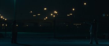 Movie still from “Waist Deep” (2006), directed by Vondie Curtis-Hall – A street light in the dark at night time; Extreme Wide shot, High angle