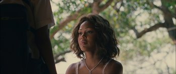 Movie still from “Waist Deep” (2006), directed by Vondie Curtis-Hall – A beautiful woman with a necklace looking to her left; Close Up shot, Over the shoulder angle