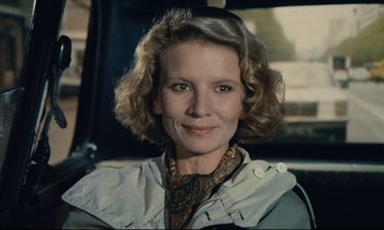 Movie still from “Waiter!” (1983), directed by Claude Sautet – A person wearing a jacket; Close Up shot, Low angle