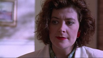 Movie still from “Waiting for Guffman” (1996), directed by Christopher Guest – A person wearing a jacket; Close Up shot, Over the shoulder angle