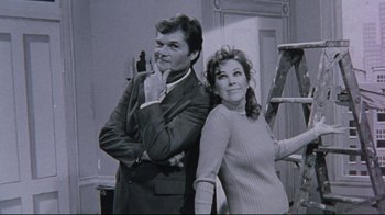 Movie still from “Waiting for Guffman” (1996), directed by Christopher Guest – A man and a woman posing for a picture; Medium shot, Low angle