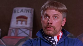 Movie still from “Waiting for Guffman” (1996), directed by Christopher Guest – A person wearing a neck scarf; Close Up shot, Low angle