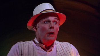 Movie still from “Waiting for Guffman” (1996), directed by Christopher Guest – A person wearing a white hat; Close Up shot, High angle