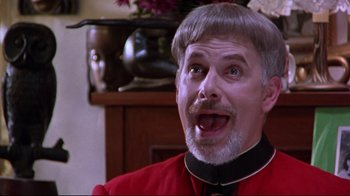 Movie still from “Waiting for Guffman” (1996), directed by Christopher Guest – A person wearing a suit and tie; Close Up shot, Low angle