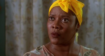 Movie still from “Waiting to Exhale” (1995), directed by Forest Whitaker – A person wearing a head scarf; Close Up shot, Low angle