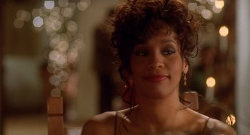 Movie still from “Waiting to Exhale” (1995), directed by Forest Whitaker – A person wearing a dress; Close Up shot, Over the shoulder angle