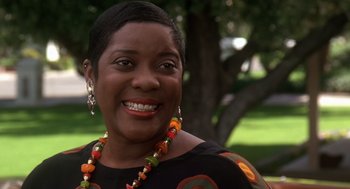 Movie still from “Waiting to Exhale” (1995), directed by Forest Whitaker – A person wearing a necklace; Close Up shot, Low angle