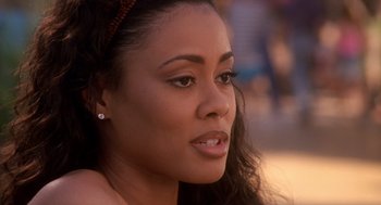 Movie still from “Waiting to Exhale” (1995), directed by Forest Whitaker – A woman's face in a park setting; Close Up shot, Over the shoulder angle