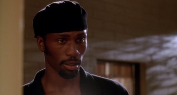 Movie still from “Waiting to Exhale” (1995), directed by Forest Whitaker – A person wearing a hat; Close Up shot, Low angle