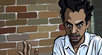 Movie still from “Waking Life” (2001), directed by Richard Linklater – A man is sitting in front of a brick wall; Close Up shot, Over the shoulder angle