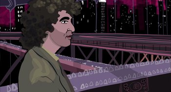 Movie still from “Waking Life” (2001), directed by Richard Linklater – A man with curly black hair standing in front of a bridge; Medium shot, Over the shoulder angle